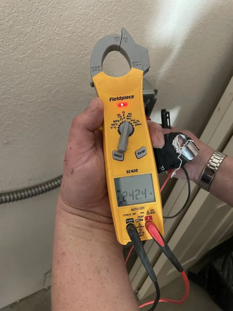 Voltage testing with clamp meter during Generator Installation in Port St. John